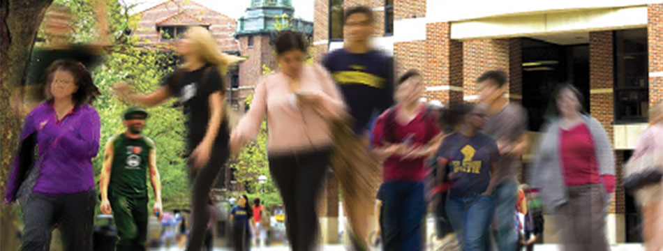 Blurred image of student walking on campus